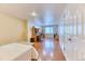 Large finished basement with wood laminate floors, a bed, and an office desk at 2464 Remington Rd, Elizabeth, CO 80107