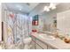 Bathroom featuring tiled floors and shower tub combo at 2464 Remington Rd, Elizabeth, CO 80107