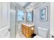 Simple bathroom with a single sink vanity, medicine cabinet, and a framed floral print at 2464 Remington Rd, Elizabeth, CO 80107