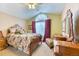 Comfortable bedroom with large window and unique decor at 2464 Remington Rd, Elizabeth, CO 80107