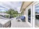 Spacious deck with outdoor seating, perfect for enjoying views of the landscaped backyard and trees at 2464 Remington Rd, Elizabeth, CO 80107