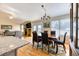Dining room with chandelier, hardwood floors and sliding door to outdoor deck at 2464 Remington Rd, Elizabeth, CO 80107