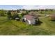 Spacious two-story home on a large lot with a deck, gazebo, mature trees and green grass at 2464 Remington Rd, Elizabeth, CO 80107