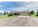 Charming home with a two-car garage, a gravel driveway, and a well-maintained lawn at 2464 Remington Rd, Elizabeth, CO 80107