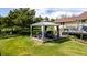 Backyard featuring a gazebo with patio furniture and manicured lawn at 2464 Remington Rd, Elizabeth, CO 80107