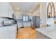 Bright kitchen features stainless steel appliances, granite countertops, and white cabinets at 2464 Remington Rd, Elizabeth, CO 80107