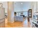 Bright kitchen features stainless steel appliances, granite countertops, and hardwood floors at 2464 Remington Rd, Elizabeth, CO 80107