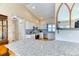 Bright kitchen featuring granite countertops, white cabinets, and stainless steel appliances at 2464 Remington Rd, Elizabeth, CO 80107