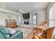 Cozy living room with a fireplace, built-in shelves, and a comfortable seating area at 2464 Remington Rd, Elizabeth, CO 80107