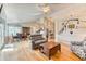 Inviting living space with hardwood floors and an open floor plan to the kitchen and dining area at 2464 Remington Rd, Elizabeth, CO 80107