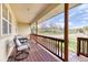 Inviting covered porch with comfortable seating, offering a relaxing outdoor space at 2464 Remington Rd, Elizabeth, CO 80107