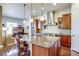 Modern kitchen featuring a large island and built-in office space at 9129 Kornbrust Dr, Lone Tree, CO 80124