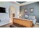 Main bedroom with a wooden sleigh bed and a view of the ensuite bathroom at 9129 Kornbrust Dr, Lone Tree, CO 80124