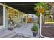Relaxing back patio with cozy seating, lush greenery, and a covered structure providing shade and comfort at 1431 S Glencoe St, Denver, CO 80222