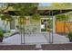 Inviting back patio featuring outdoor seating, hanging floral baskets, and a sliding glass door leading indoors at 1431 S Glencoe St, Denver, CO 80222