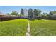 Expansive backyard with lush green lawn and mature trees, perfect for outdoor activities and relaxation at 1431 S Glencoe St, Denver, CO 80222