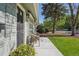 Side view of inviting front porch with flowers and comfortable seating arrangement at 1431 S Glencoe St, Denver, CO 80222