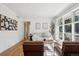 Bright living room with hardwood floors, large windows, and contemporary furnishings at 1431 S Glencoe St, Denver, CO 80222