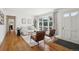 Bright living room with hardwood floors, large windows, and contemporary furnishings at 1431 S Glencoe St, Denver, CO 80222