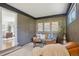 Cozy living room with wood paneled walls, comfortable seating, and stylish decor at 1431 S Glencoe St, Denver, CO 80222