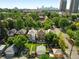 Lovely residential neighborhood with green lawns and mature shade trees, and the city in the background at 1582 Steele St, Denver, CO 80206
