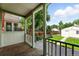 Charming covered back porch overlooking a fenced yard and includes a stone paver patio at 1582 Steele St, Denver, CO 80206