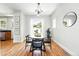 Bright dining room with hardwood floors, modern lighting, and comfortable seating at 1582 Steele St, Denver, CO 80206