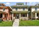 Charming brick two-story home with a manicured front lawn and inviting front porch at 1582 Steele St, Denver, CO 80206