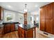 Bright kitchen featuring wood cabinetry, granite countertops, and access to the exterior at 1582 Steele St, Denver, CO 80206