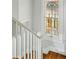 Stairwell featuring a beautiful stained glass window at 1582 Steele St, Denver, CO 80206