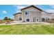 Home's exterior featuring a well-maintained yard, a patio, and backyard fencing at 169 Westin Ave, Brighton, CO 80603