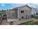 Aerial view of the backyard, highlighting the patio, fencing, and surrounding landscape at 169 Westin Ave, Brighton, CO 80603