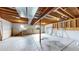 Unfinished basement with concrete floor, exposed ceiling, and some framing completed at 169 Westin Ave, Brighton, CO 80603