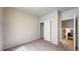 Neutral bedroom features a closet with sliding doors and a view to other rooms at 169 Westin Ave, Brighton, CO 80603