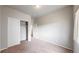 Bright bedroom showcases a closet with sliding doors and view to other rooms at 169 Westin Ave, Brighton, CO 80603