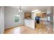 Bright dining area with hardwood floors, natural light, and a view into the kitchen area, perfect for entertaining at 169 Westin Ave, Brighton, CO 80603