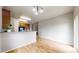 Bright dining area featuring wood floors, stylish lighting, and an open layout, perfect for entertaining guests at 169 Westin Ave, Brighton, CO 80603