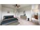 A cozy main bedroom featuring neutral decor, a ceiling fan, and an ensuite bathroom at 169 Westin Ave, Brighton, CO 80603