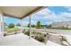 Covered front porch with view of landscaped front yard and quiet street at 169 Westin Ave, Brighton, CO 80603
