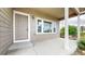 Inviting covered porch features a large window and ample space for relaxing or greeting guests at 169 Westin Ave, Brighton, CO 80603