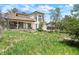 Large backyard with lawn, garden area, and two-story home at 15916 E Crestridge Pl, Centennial, CO 80015