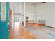 Bright foyer with hardwood floors and high ceilings, leading to other rooms at 15916 E Crestridge Pl, Centennial, CO 80015