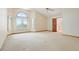Large main bedroom with vaulted ceiling, large windows, and ceiling fan at 15916 E Crestridge Pl, Centennial, CO 80015