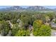 Stunning aerial view of the property nestled in a lush, green landscape with breathtaking mountain views at 255 Kiowa Pl, Boulder, CO 80303