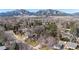 Scenic aerial view of a home nestled among trees with mountains in the background, a tranquil setting at 255 Kiowa Pl, Boulder, CO 80303