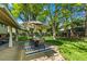 Charming backyard with patio seating, umbrella, and lush lawn, ideal for outdoor enjoyment at 255 Kiowa Pl, Boulder, CO 80303