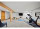 Finished basement with exercise equipment and large TV, ideal for fitness and entertainment at 255 Kiowa Pl, Boulder, CO 80303