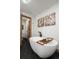 Contemporary bathroom features a freestanding tub, modern black fixtures, and unique wall art at 255 Kiowa Pl, Boulder, CO 80303