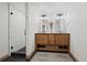 Modern bathroom with a glass walk-in shower, dual sinks, and black tile floor at 255 Kiowa Pl, Boulder, CO 80303