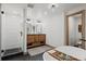 Bathroom featuring dual sinks, a soaking tub, and a tiled shower with glass door at 255 Kiowa Pl, Boulder, CO 80303